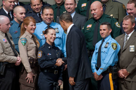 President Barack Obama talks with Sgt. Kimberly Munley, Directorate of Emergency Services, Ft. Hood Police Dept., after delivering remarks at a ceremony honoring the Top Cops award winners in the Rose Garden of the White House, May 14, 2010.   (White House Archive Phonto - Official White House Photo by Chuck Kennedy)