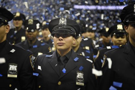 NYPD Academy graduate reacts to becoming a police officer at the NYPD Police Academy Graduation Ceremony at Madison Square Garden, 2014. 
Credit: Diana Robinson/Mayoral Photography Office via Flickr