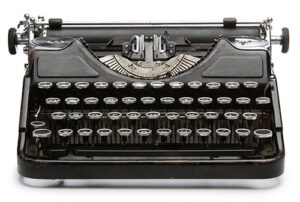 Vintage rusty typewriter isolated on white background